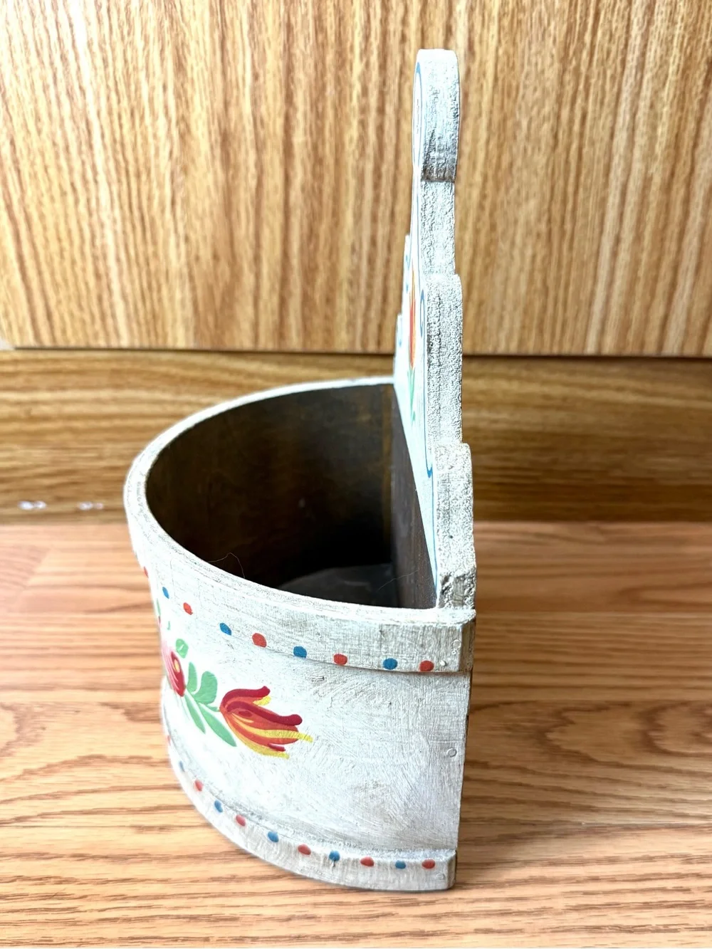 A wooden wall box for farmhouse decor,featuring hand-painted floral designs